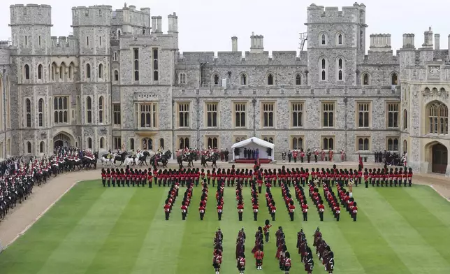 Britain's Kate, Princess of Wales, Prince William, first lady Melania Trump, President Donald Trump, Britain's King Charles III and Queen Camilla review the Guard of Honour at Windsor Castle in Windsor, England, Wednesday Sept. 17, 2025. (Chris Jackson/Pool Photo via AP)