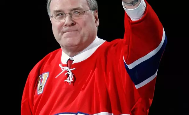 FILE - Former Montreal Canadiens goaltender Ken Dryden waves as he is intorduced at the Bell Centre as his jersey is retired during a pre-game ceremony, on Jan. 29, 2007 in Montreal. (Ryan Remiorz/The Canadian Press via AP, File)