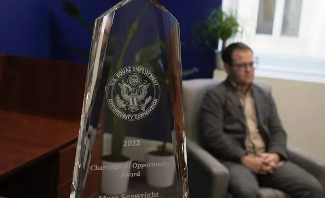 An award is shown as Marc Seawright is interviewed at the Katz Banks Kumin law office in San Francisco, July 14, 2025. (AP Photo/Jeff Chiu)