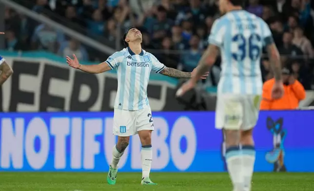 Santiago Solari of Argentina's Racing Club celebrates scoring his side's opening goal against Argentina's Velez Sarsfield during a Copa Libertadores quarterfinal second leg soccer match at Presidente Peron stadium in Avellaneda, Argentina, Tuesday, Sept. 23, 2025. (AP Photo/Gustavo Garello)