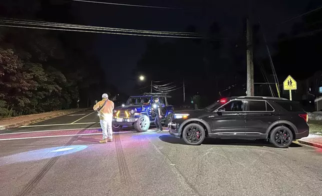 Police block a road to a country club where a shooting happened at Sky Meadow Country Club in Nashua, New Hampshire, Saturday, Sept. 20, 2025. (AP Photo/Michael Casey)