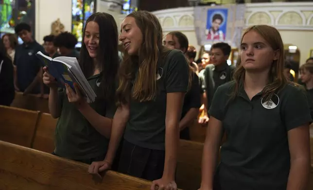 St. John Berchmans' school students attend a Mass at Blessed Carlo Acutis Parish on Wednesday, Sept. 3, 2025, in Chicago. (AP Photo/Jessie Wardarski)