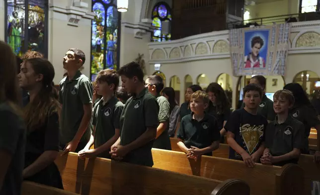 St. John Berchmans' school students attend a Mass at Blessed Carlo Acutis Parish on Wednesday, Sept. 3, 2025, in Chicago. (AP Photo/Jessie Wardarski)