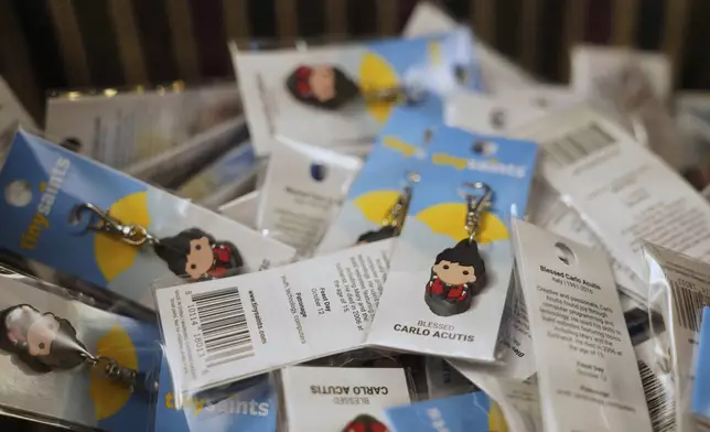 Blessed Carlo Acutis keychains sit outside the sanctuary of Blessed Carlo Acutis Parish during weekday Mass for the students of St. John Berchmans' school on Wednesday, Sept. 3, 2025, in Chicago. (AP Photo/Jessie Wardarski)