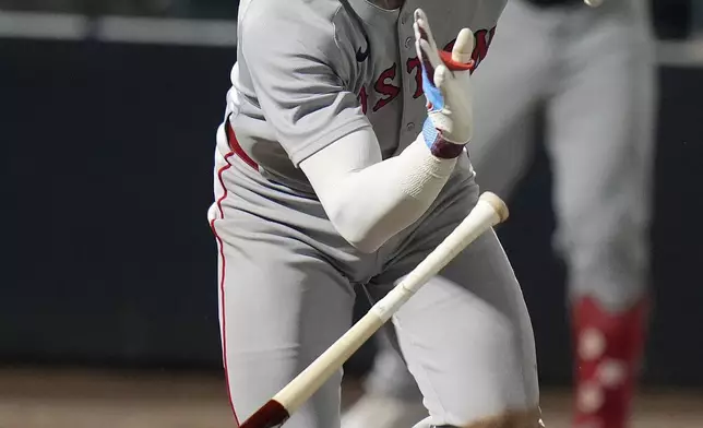 Boston Red Sox's Trevor Story watches his RBI single off Tampa Bay Rays pithcer Jesse Scholtens during the ninth inning of a baseball game Saturday, Sept. 20, 2025, in Tampa, Fla. (AP Photo/Chris O'Meara)