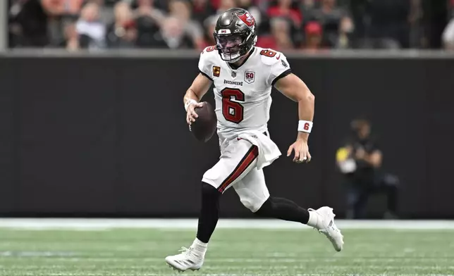 Tampa Bay Buccaneers quarterback Baker Mayfield (6) runs the ball during the first half of an NFL football game against the Atlanta Falcons, Sunday, Sept. 7, 2025, in Atlanta. (AP Photo/Danny Karnik)
