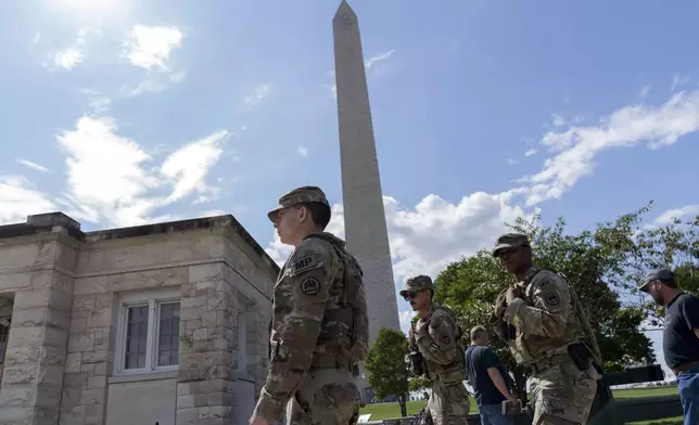 Members of the Louisiana National Guard patrol the National Mall Sunday, Sept. 7, 2025, in Washington. (AP Photo/Jose Luis Magana)