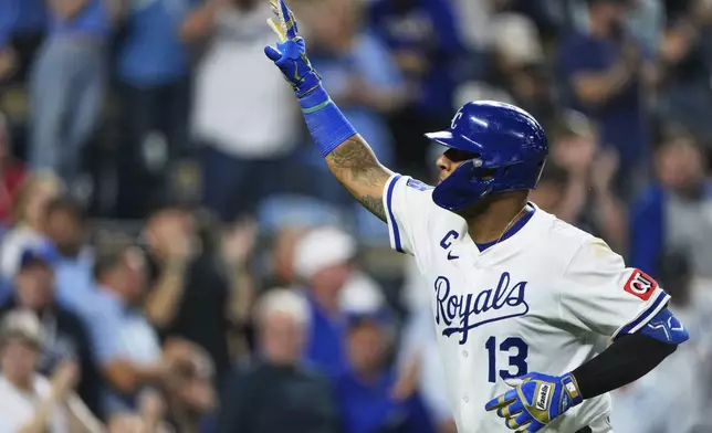 Kansas City Royals' Salvador Perez celebrates as he crosses the plate after hitting a solo home run during the seventh inning of a baseball game against the Los Angeles Angels, Thursday, Sept. 4, 2025, in Kansas City, Mo. (AP Photo/Charlie Riedel)