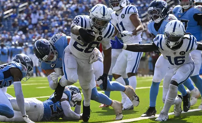 Indianapolis Colts running back Jonathan Taylor (28) runs in for a touchdown against the Tennessee Titans during the second half of an NFL football game Sunday, Sept. 21, 2025, in Nashville, Tenn. (AP Photo/John Amis)