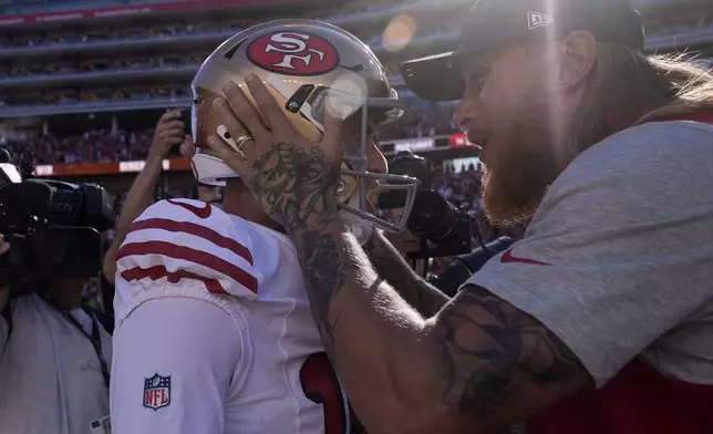 San Francisco 49ers kicker Eddy Piñeiro, left, celebrates with George Kittle after his game-winning field goal after an NFL football game against the Arizona Cardinals, Sunday, Sept. 21, 2025, in Santa Clara, Calif. (AP Photo/Godofredo A. Vásquez)