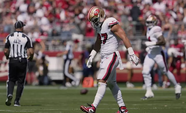 San Francisco 49ers defensive end Nick Bosa walks off the field during the first half of an NFL football game against the Arizona Cardinals, Sunday, Sept. 21, 2025, in Santa Clara, Calif. (AP Photo/Godofredo A. Vásquez)