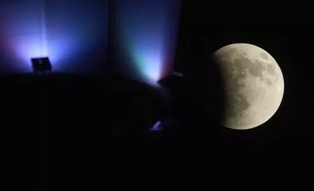 A partial lunar eclipse is seen in Baghdad, Iraq, Sunday, Sept. 7, 2025. (AP Photo/Hadi Mizban)