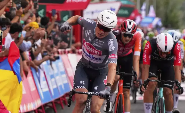 Belgian cyclist Jasper Philipsen wins the nineteenth stage of the Spanish La Vuelta cycling race, from Rueda to Guijuelo, Spain, Friday, Sept. 12, 2025. (AP Photo/Manu Fernandez)