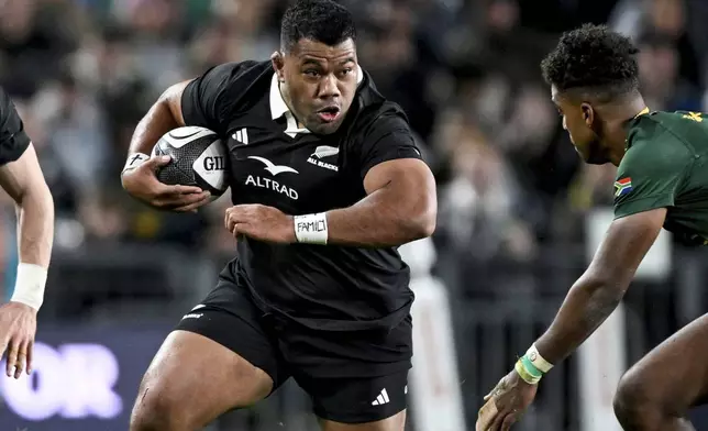 Samisoni Taukei'aho of New Zealand runs at the defence during their rugby international against the Springboks at Eden Park in Auckland, New Zealand, Saturday, Sept. 6, 2025. (Andrew Cornaga/Photosport via AP)