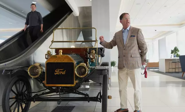 Ford heritage and brand manager Ted Ryan speaks in front of a vintage Ford Model T during an interview at the current Ford World Headquarters, Thursday, Sept. 11, 2025, in Dearborn, Mich. (AP Photo/Ryan Sun)