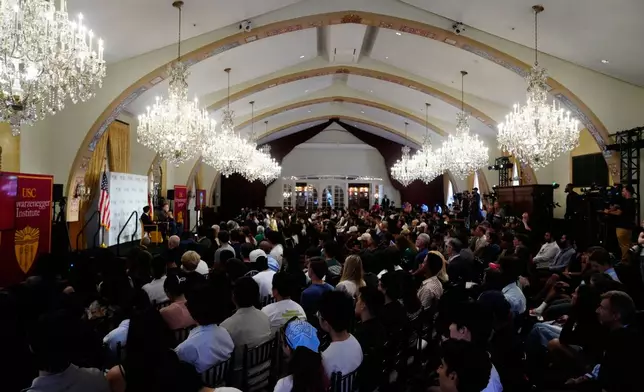 Former California Gov. Arnold Schwarzenegger, at podium on left, joins University of Southern California interim president Beong-Soo Kim for a conversation on democracy and Schwarzenegger's opposition to Proposition 50, a California ballot measure to redraw U.S. House maps to boost Democrats, at the USC campus in Los Angeles, Monday, Sept. 15, 2025. (AP Photo/Damian Dovarganes)