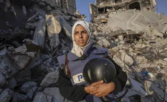 Freelance journalist Mariam Dagga, 33, who had been working with the Associated Press and other outlets during the Gaza war, poses for a portrait in Khan Younis, southern Gaza Strip, on June 14, 2024. Dagga was one of several journalists killed along with other people in Israeli strikes on Nasser Hospital in Khan Younis on Aug. 25, 2025. (AP Photo/Jehad Alshrafi)
