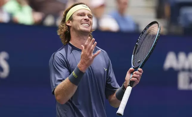 Andrey Rublev, of Russia, reacts during a match against Felix Auger-Aliassime, of Canada, in the fourth round of the US Open tennis championships, Monday, Sept. 1, 2025, in New York. (AP Photo/Kirsty Wigglesworth)
