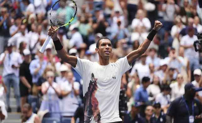 Felix Auger-Aliassime, of Canada, celebrates after winning a match against Andrey Rublev, of Russia, during the fourth round of the US Open tennis championships, Monday, Sept. 1, 2025, in New York. (AP Photo/Kirsty Wigglesworth)