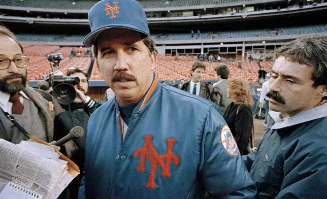 FILE - New York Mets Manager Davey Johnson talks with reporters prior to the opening game of the World Series between the Mets and the Boston Red Sox at Shea Stadium in New York, Oct. 18, 1986. (AP Photo/Paul Bemoit, File)
