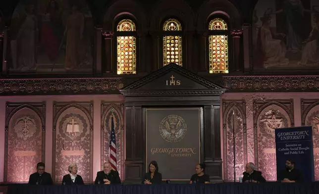From left to right, Auxiliary Bishop Evelio Menjivar-Ayala of Washington, D.C.; Sister Norma Pimentel; Archbishop Thomas Wenski of Miami; panel moderator Kim Daniels; Nicole Flores, a religious studies professor at University of Virginia; Mark Seitz, bishop of El Paso, Texas; and the Rev. Guillermo Treviño, Jr., attend a panel at Georgetown University in Washington, Thursday, Sept. 11, 2025. (AP Photo/Luis Andres Henao)
