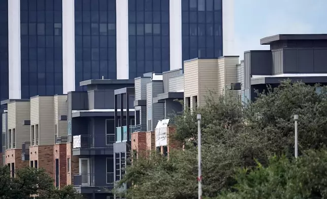 An apartment building close to a U.S. Immigration and Customs Enforcement office is shown after a shooting, in Dallas on Wednesday, Sept. 24, 2025. (AP Photo/Julio Cortez)