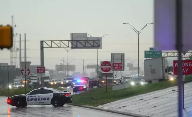Police block off the street close to a U.S. Immigration and Customs Enforcement office after a reported shooting, in Dallas on Wednesday, Sept. 24, 2025. (AP Photo/Julio Cortez)