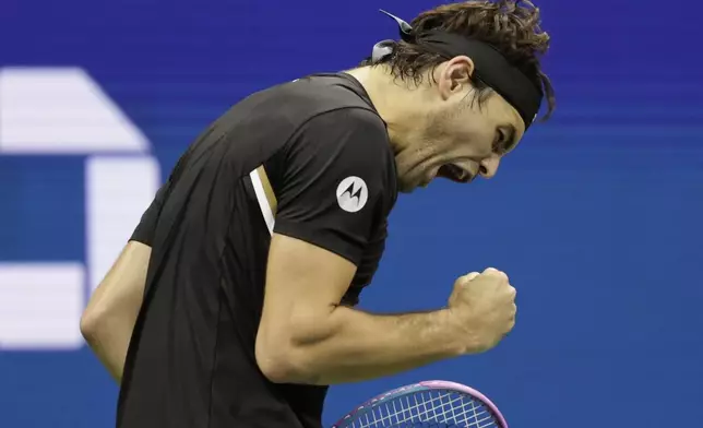 Taylor Fritz, of the United States, reacts to winning a point against Novak Djokovic, of Serbia, during the quarterfinal round of the U.S. Open tennis championships, Tuesday, Sept. 2, 2025, in New York. (AP Photo/Adam Hunger)