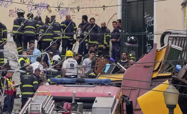 Emergency teams work at the site of a derailed electric streetcar in Lisbon, Portugal, Wednesday, Sept. 3, 2025. (AP Photo/Armando Franca)