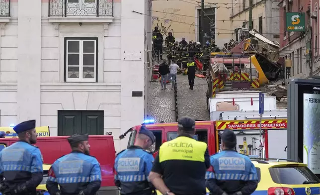 Emergency teams work at the site of a derailed electric streetcar in Lisbon, Portugal, Wednesday, Sept. 3, 2025. (AP Photo/Armando Franca)