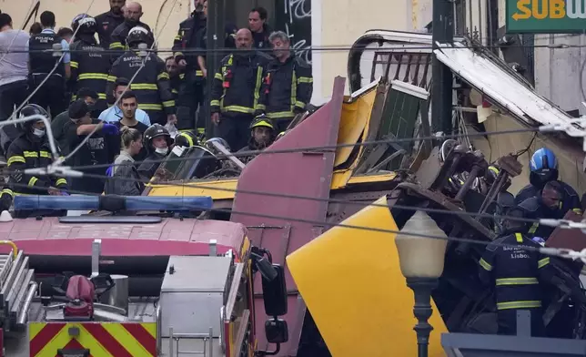Emergency teams work at the site of a derailed electric streetcar in Lisbon, Portugal, Wednesday, Sept. 3, 2025. (AP Photo/Armando Franca)