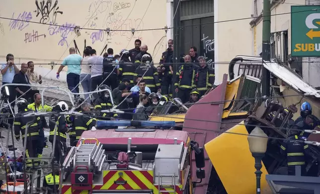 Emergency teams work at the site of a derailed electric streetcar in Lisbon, Portugal, Wednesday, Sept. 3, 2025. (AP Photo/Armando Franca)