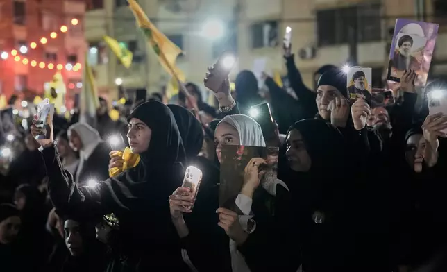 People gather at the site where Hezbollah leader Hassan Nasrallah was killed in Israeli airstrikes on Sept. 27, 2024, a day before the first anniversary of his death, in the Haret Hreik suburb south of Beirut, Lebanon, Friday, April 26, 2025. (AP Photo/Hassan Ammar)