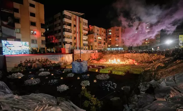 People gather at the site where Hezbollah leader Hassan Nasrallah was killed in Israeli airstrikes on Sept. 27, 2024, a day before the first anniversary of his death, in the Haret Hreik suburb south of Beirut, Lebanon, Friday, April 26, 2025. (AP Photo/Hassan Ammar)