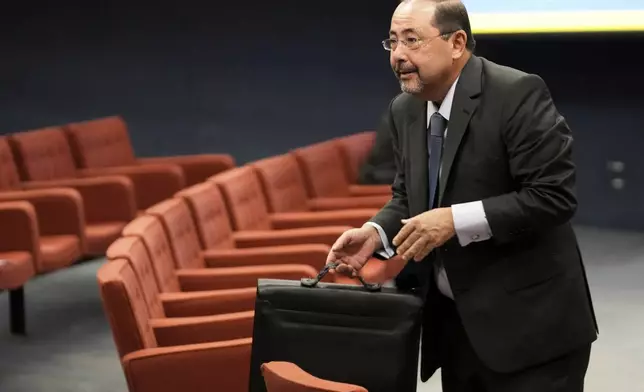 Celso Vilardi, a lawyer for Brazil's former President Jair Bolsonaro, arrives for the verdict and sentencing phase of Bolsonaro's Supreme Court trial for allegedly leading a coup plot to keep him in office after his 2022 election defeat in Brasília, Brazil, Wednesday, Sept. 3, 2025. (AP Photo/Eraldo Peres)