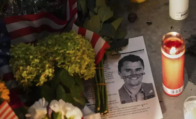 A photo Charlie Kirk, the CEO and co-founder of Turning Point USA who was shot and killed, sits at a vigil in his memory, Thursday, Sept. 11, 2025, in Orem, Utah. (AP Photo/Lindsey Wasson)