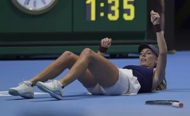 Katie Boulter, of Britain fell on court during the Billie Jean King Cup semifinals tennis match against Jessica Pegula, of the United States, at the Shenzhen Bay Sports Center Arena, in Shenzhen, China's Guangdong province, Saturday, Sept. 20, 2025. (AP Photo/Andy Wong)
