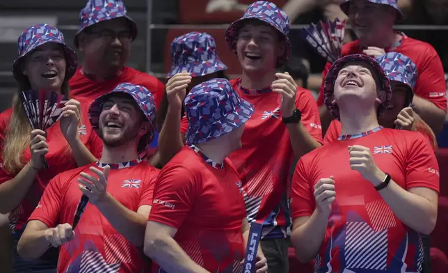 British fans cheer during the Billie Jean King Cup semifinals tennis match between Sonay Kartal, of Britain and Emma Navarro, of the United States, at the Shenzhen Bay Sports Center Arena, in Shenzhen, China's Guangdong province, Saturday, Sept. 20, 2025. (AP Photo/Andy Wong)