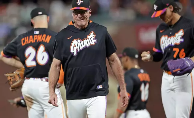 San Francisco Giants' manager Bob Melvin returns to dugout after making a 7th inning pitching change against St. Louis Cardinals during MLB game at Oracle Park in San Francisco on Tuesday, Sept. 23, 2025. (Scott Strazzante/San Francisco Chronicle via AP)