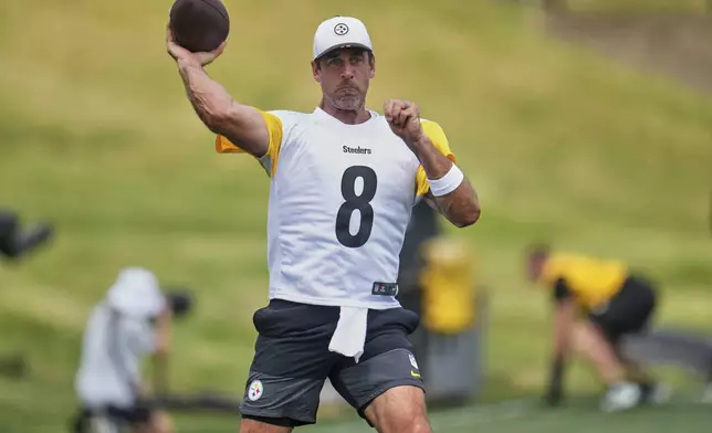 FILE - Pittsburgh Steelers quarterback Aaron Rodgers runs a drill during the NFL football team's training camp in Latrobe, Pa., Thursday, July 24, 2025. (AP Photo/Gene J. Puskar, File)