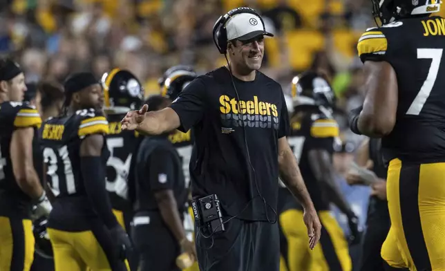 FILE - Pittsburgh Steelers quarterback Aaron Rodgers (8) reacts during a preseason NFL football game, Saturday, Aug. 16, 2025, in Pittsburgh. (AP Photo/Matt Durisko, File)