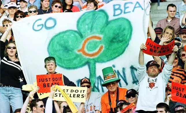 FILE - Football fans cheer during American Bowl action between the Chic ago Bears and the Pittsburgh Steelers at Croke Park in Dublin, Ireland, Sunday, July 27, 1997. (AP Photo/Adrian Dennis, File)