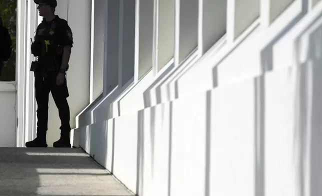 A law enforcement officer from the Department of Homeland Security stands watch at the Alto Lee Adams Sr. U.S. Courthouse as jury selection began in the trial of Ryan Routh, charged with trying to assassinate Donald Trump while he played golf last year in South Florida, Monday, Sept. 8, 2025, in Fort Pierce, Fla. (AP Photo/Rebecca Blackwell)