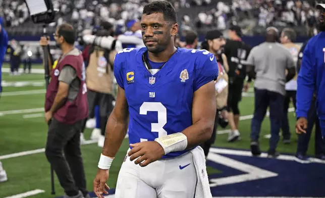 New York Giants quarterback Russell Wilson (3) walks off the field after the team's overtime loss in an NFL football game against the Dallas Cowboys Sunday, Sept. 14, 2025, in Arlington, Texas. (AP Photo/Jerome Miron)