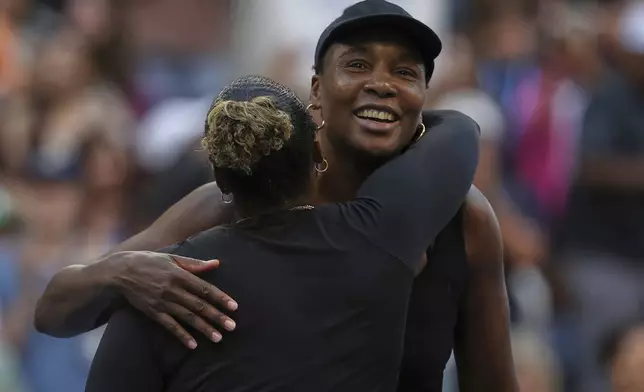 Taylor Townsend, of the United States, hugs Venus Williams, of the United States, after their quarterfinal doubles match of the U.S. Open tennis championships, Tuesday, Sept. 2, 2025, in New York. (AP Photo/Heather Khalifa)