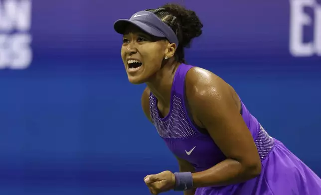 Naomi Osaka, of Japan, reacts during a match against Karolina Muchova, of the Czech Republic, in the quarterfinal round of the U.S. Open tennis championships, Wednesday, Sept. 3, 2025, in New York. (AP Photo/Adam Hunger)