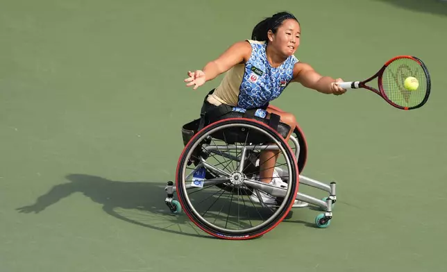 Yui Kamiji, of Japan, returns a shot to Diede De Groot, of the Netherlands, during the second round of the wheelchair men's singles of the U.S. Open tennis championships, Thursday, Sept. 4, 2025, in New York. (AP Photo/Yuki Iwamura)