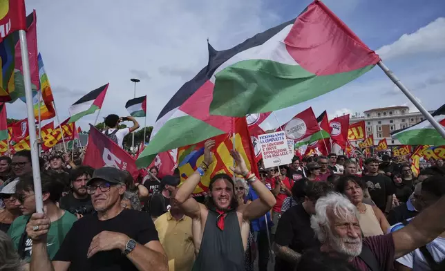 People take part in a demonstration part of a nation-wide protest and general strike against the war in Gaza, in Rome, Monday, Sept. 22, 2025. (AP Photo/Alessandra Tarantino)
