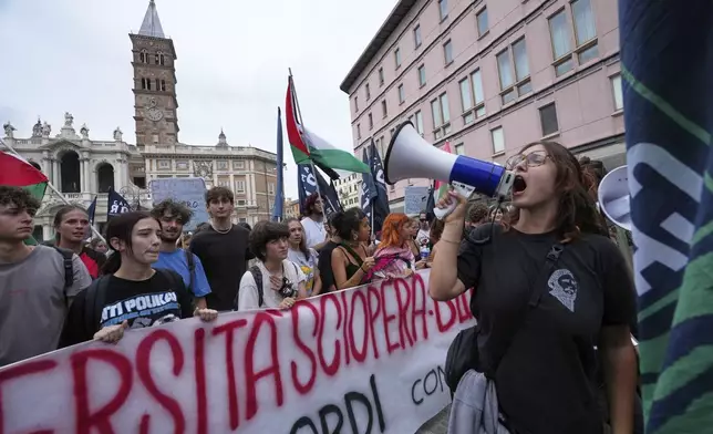 People participate at a demonstration part of a nation-wide protest and general strike against the war in Gaza, in Rome, Monday, Sept. 22, 2025. (AP Photo/Alessandra Tarantino)
