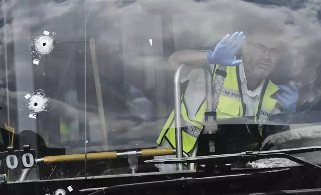 Israeli police and rescue teams inspect the scene of a shooting attack where several people killed and injured at a bus stop in Jerusalem, Monday, Sept. 8, 2025. (AP Photo/Mahmoud Illean)